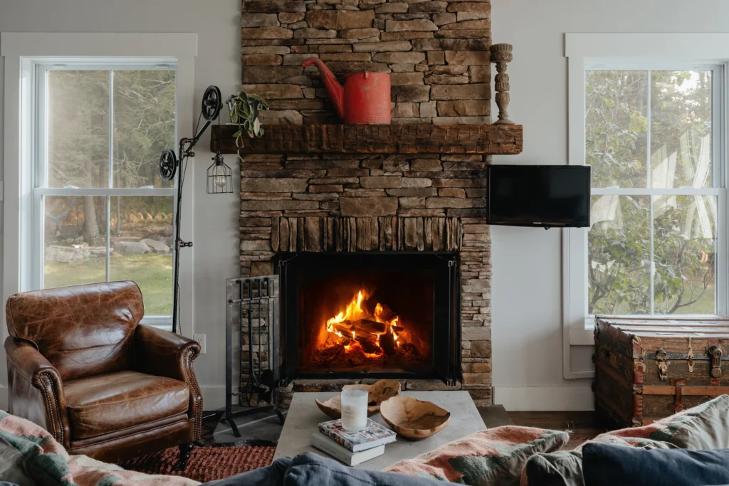Bright living room with a lit fireplace