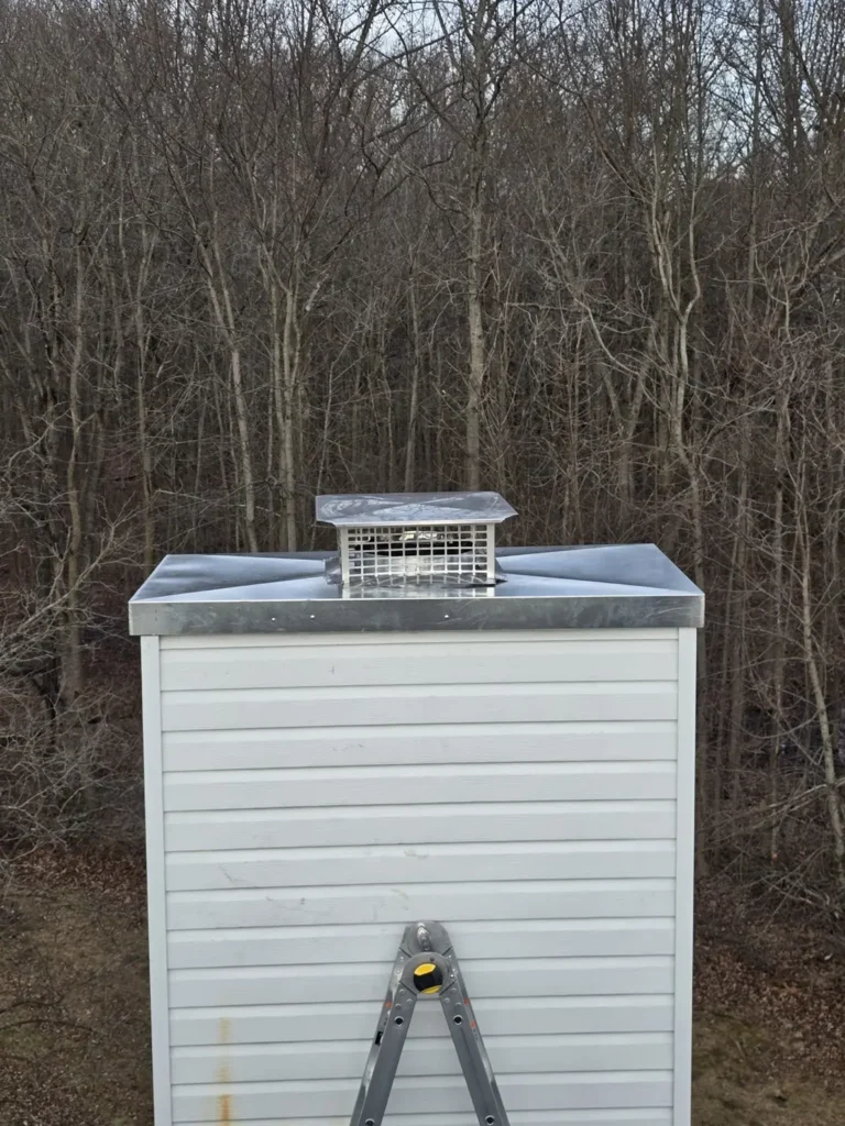 Metal chase cover with a chimney cap above a sided chase in Carneys Point