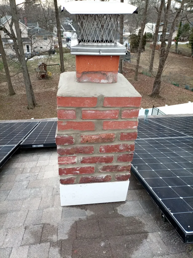 Brick chimney with crown and cap in Cherry Hill Township