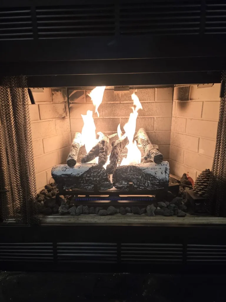 Gas log fireplace with visible flames in Egg Harbor Township