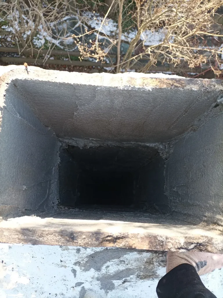 View into a rectangular fireplace flue from the chimney top in Medford