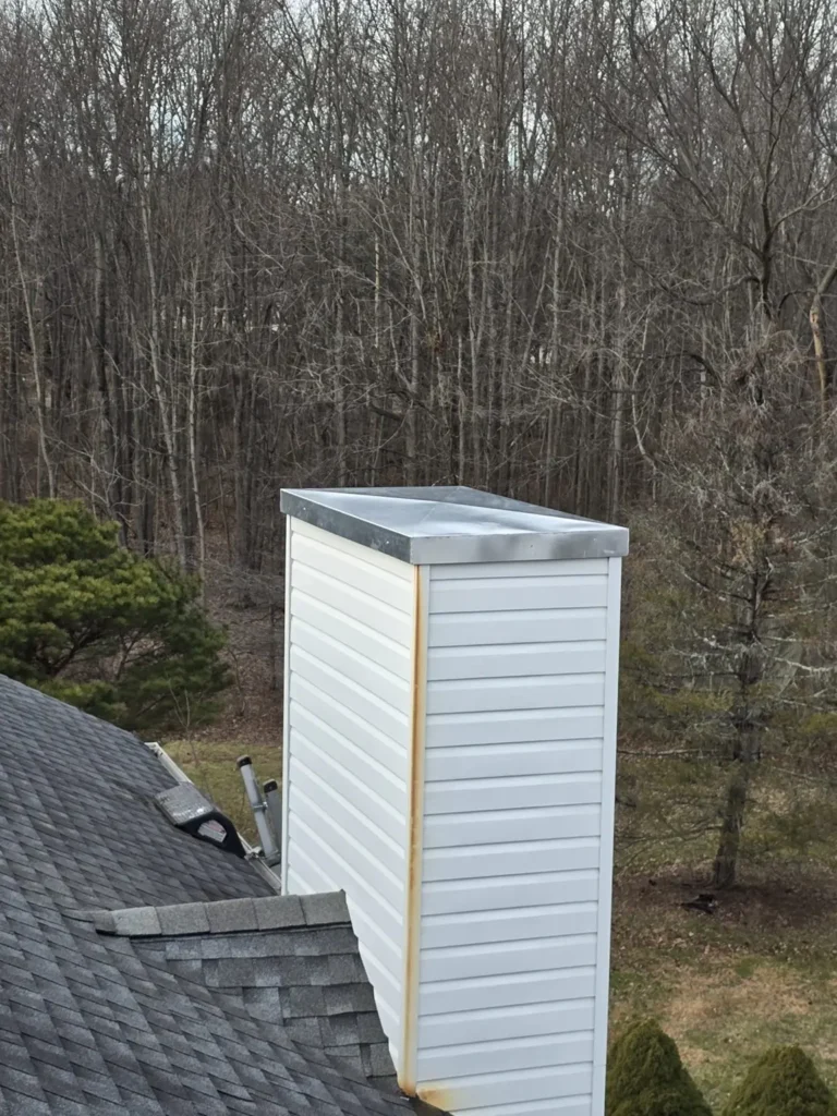 Metal cover on a second sided chimney chase at the Carneys Point property