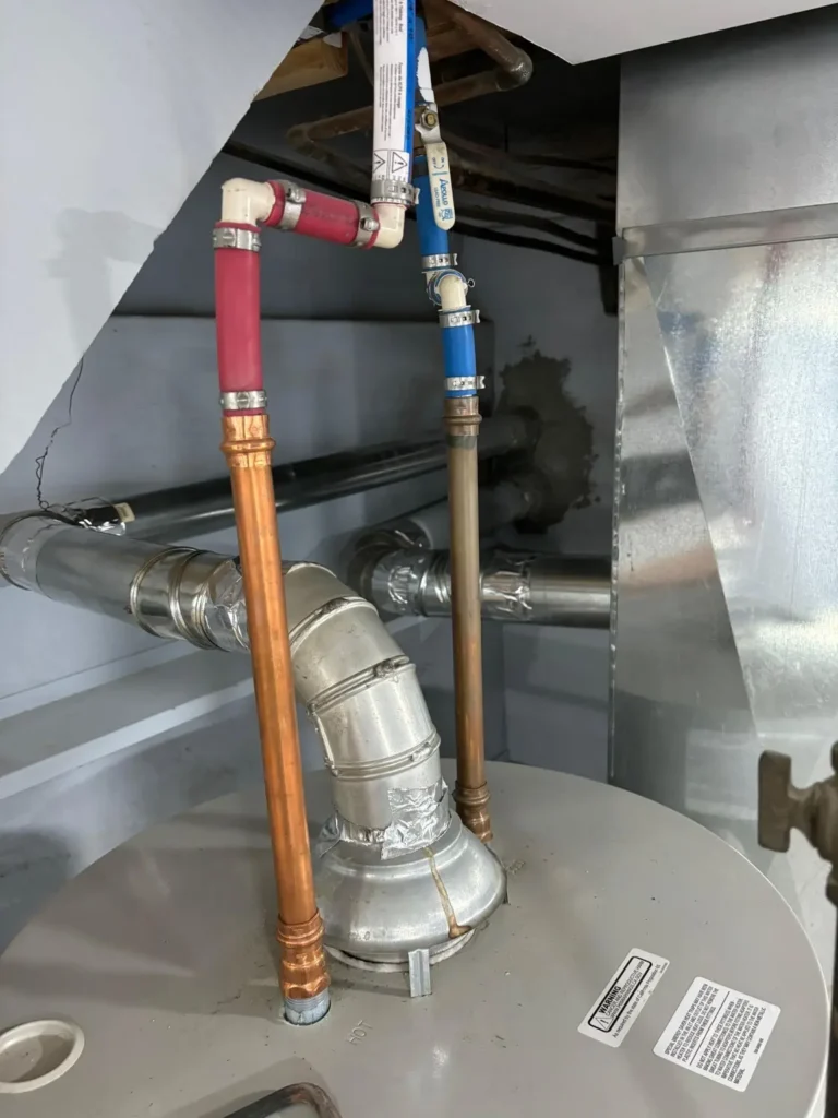 Interior vent connections beside a water heater in Gloucester Township