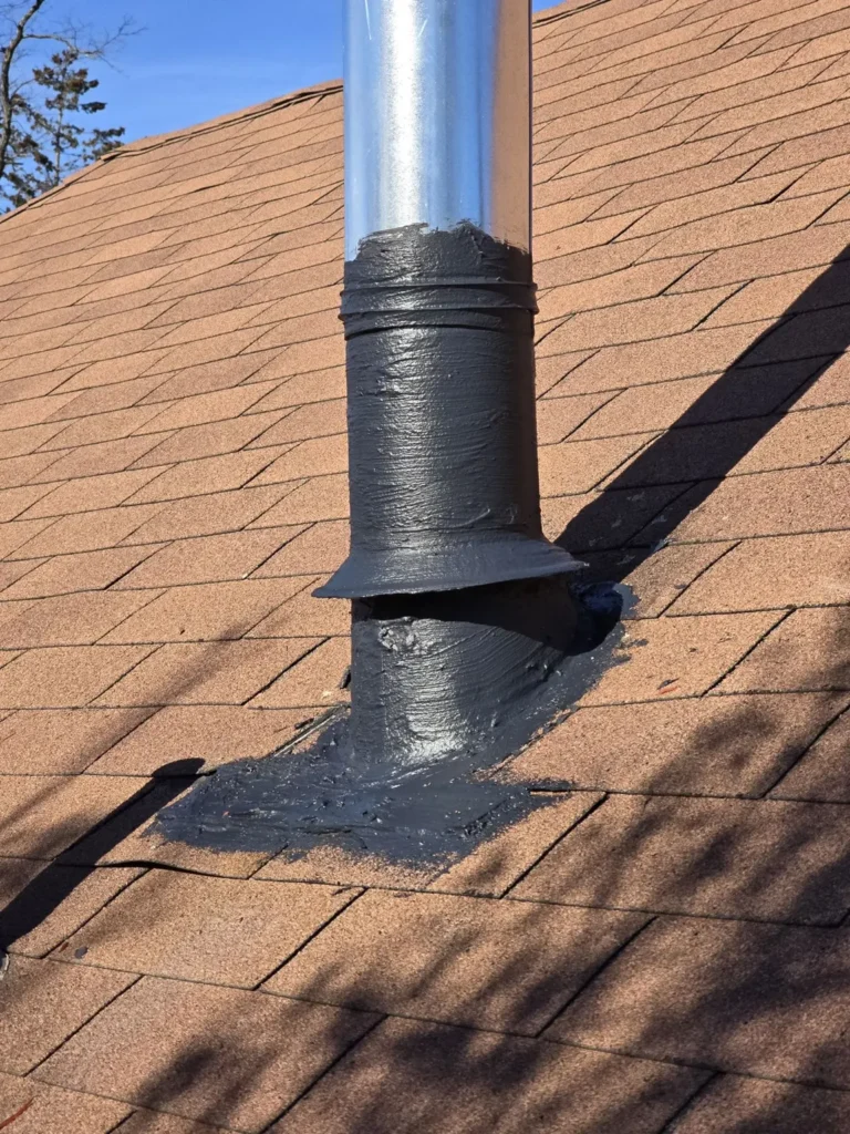 Close view of flashing at the furnace vent roof penetration in Middletown Township