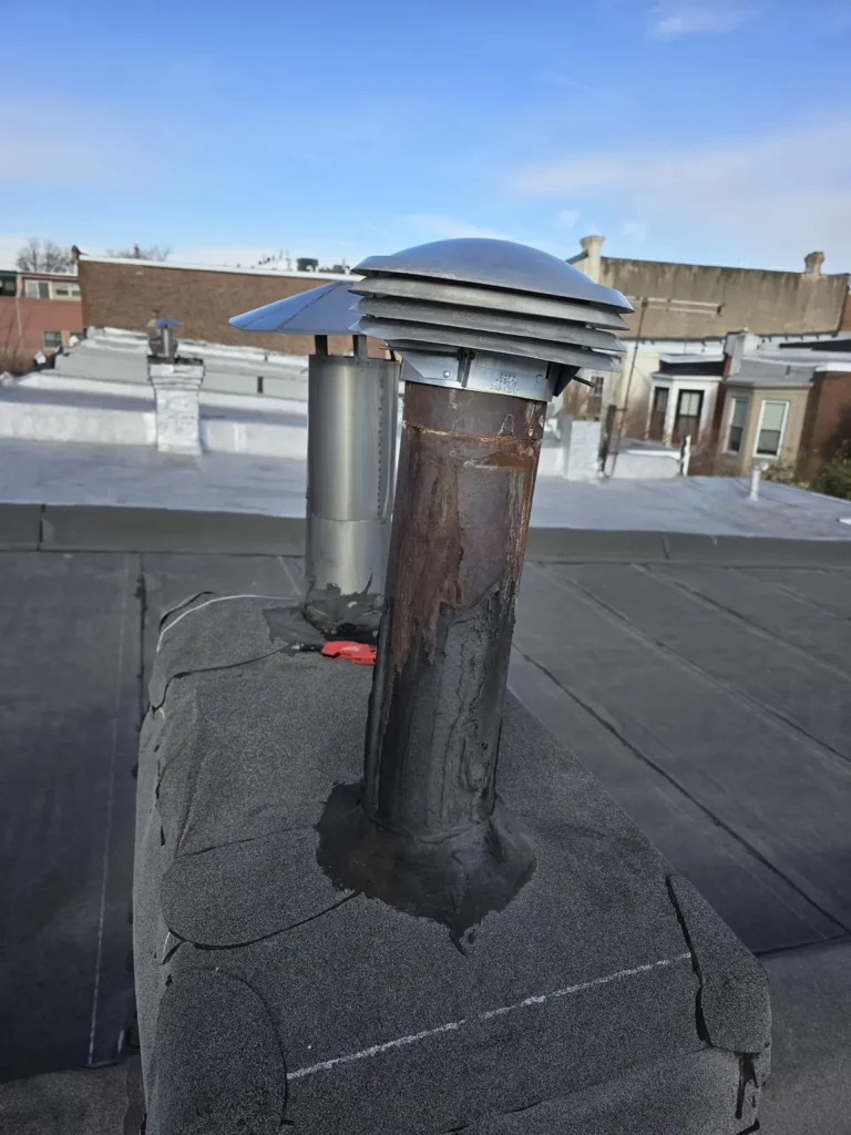 Rooftop view of two vent terminations at a Bloomsbury property