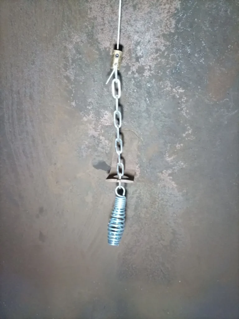 Damper operating chain and handle inside the Millville fireplace