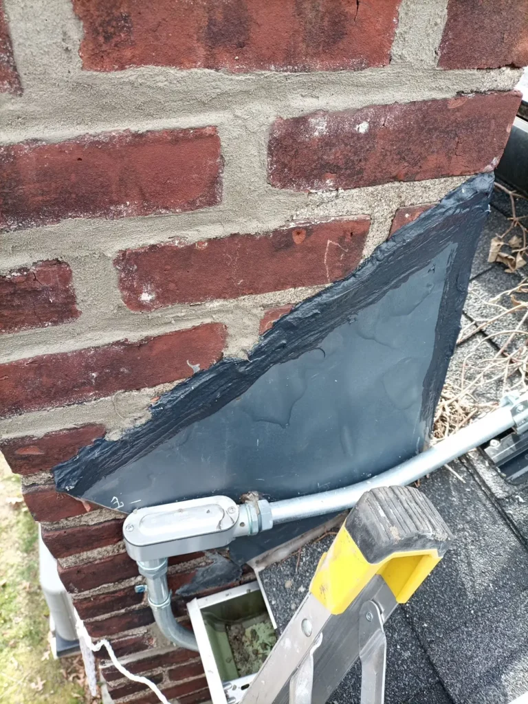 Side view of chimney flashing and brickwork in Morris Plains