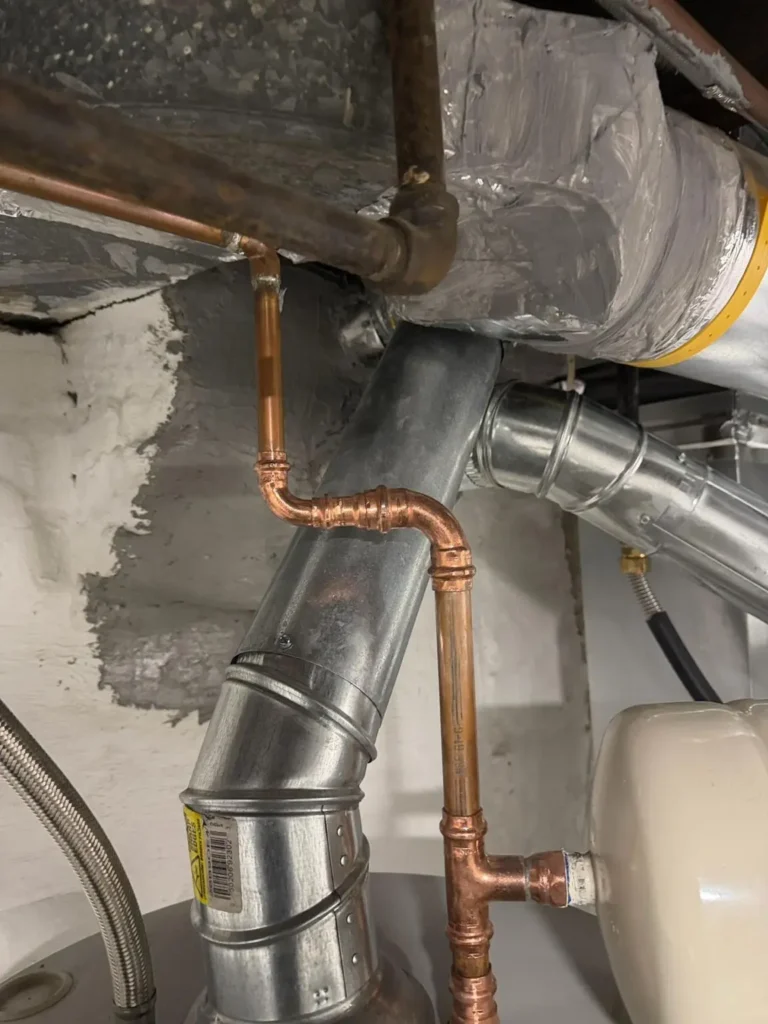 Close view of the vent connection at the chimney wall in Woodbridge Township